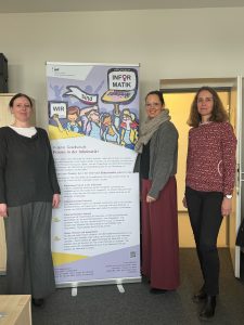 Chapter Chair Pamela Fleischmann, Vice-Chair Annika Huch and Executive Committee Member Ina Pfannschmidt with the Event roll up.